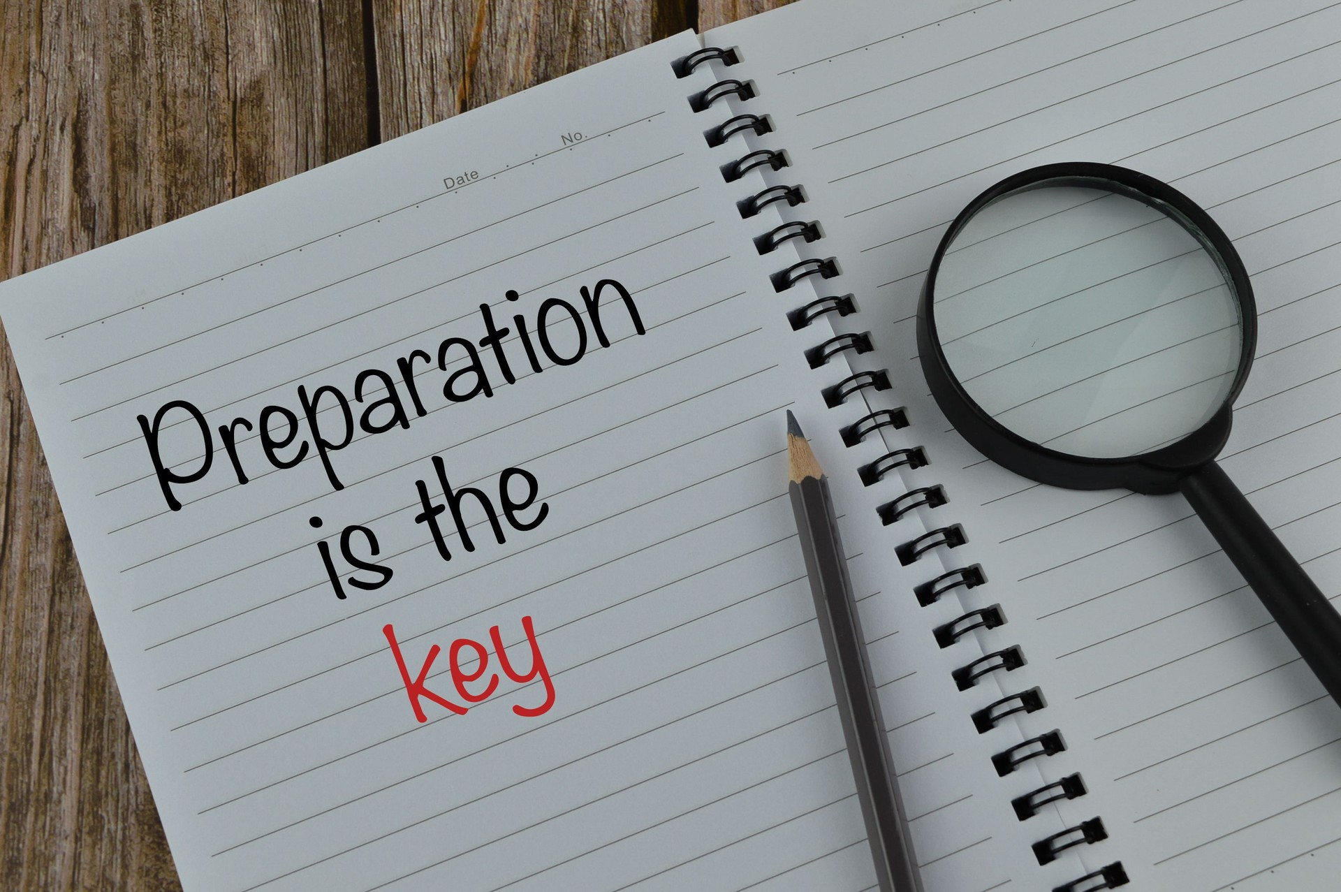 Notebook written with text PREPARATION IS THE KEY