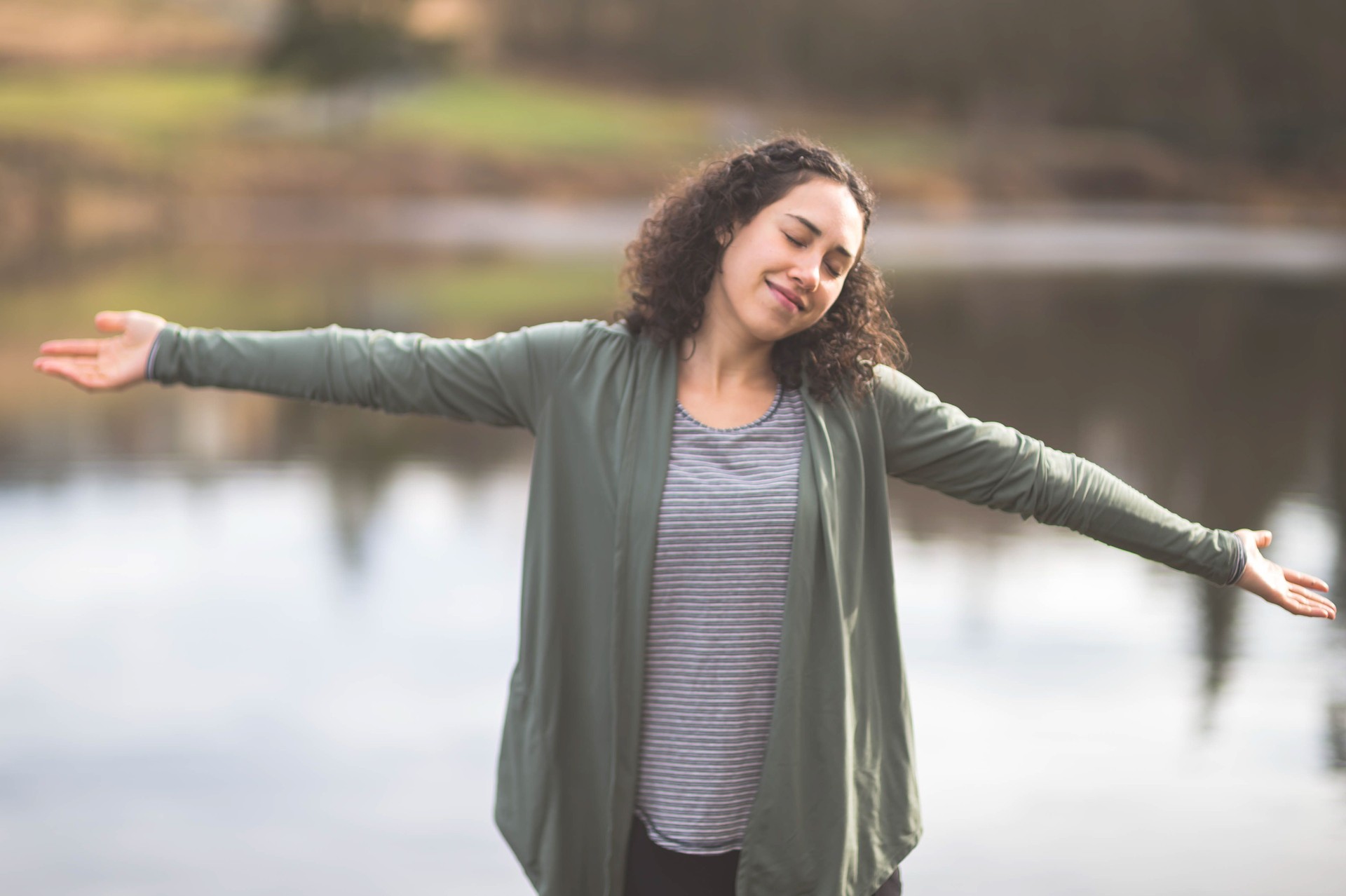 Beautiful Eurasian woman does yoga outside